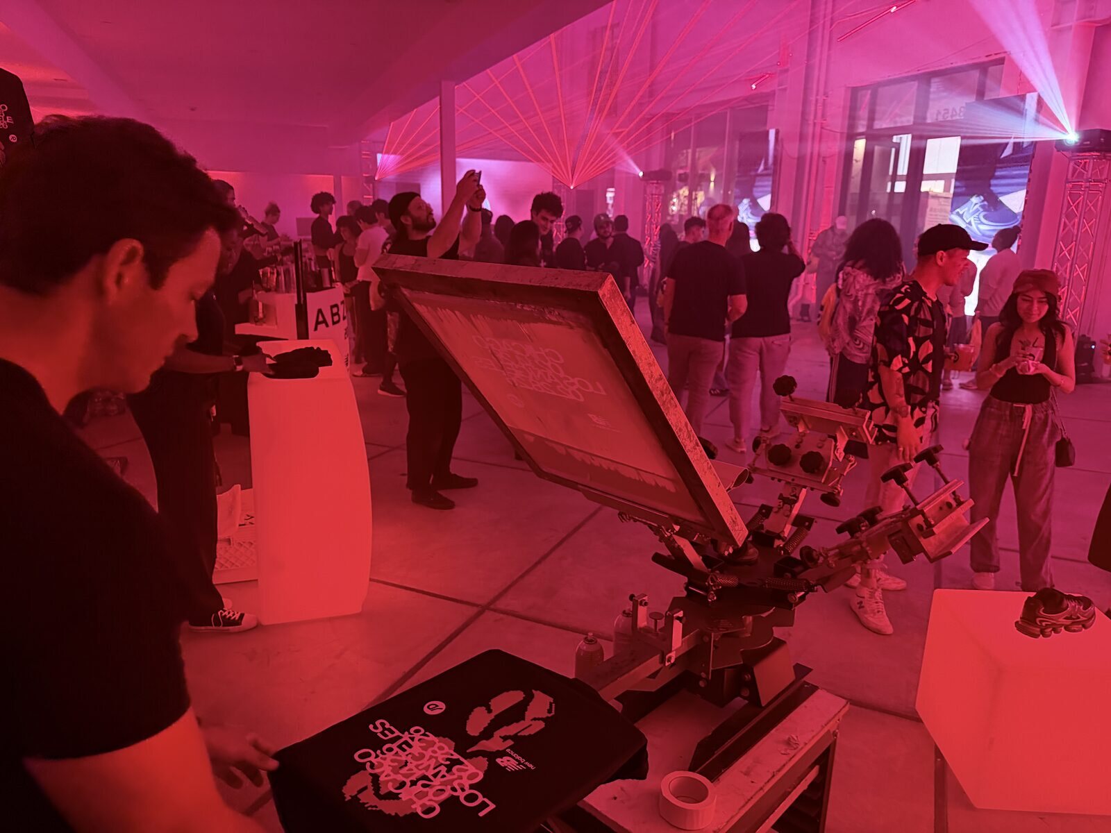 Merch Troop live screen-printing station running at a Nashville event